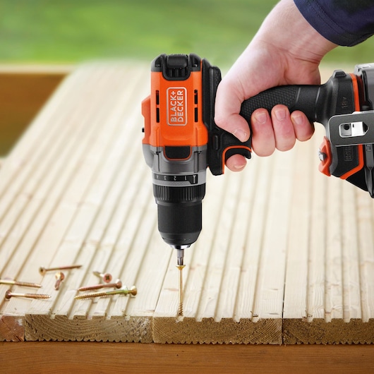 Wooden Decking being drilled into using the BLACK+DECKER® POWERCONNECT™ 18V Cordless Drill Driver.