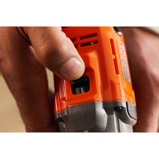 A hand switches the gear of the BLACK+DECKER® POWERCONNECT™ 18V Cordless Drill Driver.