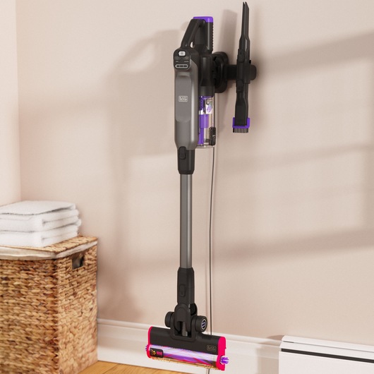 BLACK+DECKER SUMMITSERIES Stick Vac hanging on wall with attachments