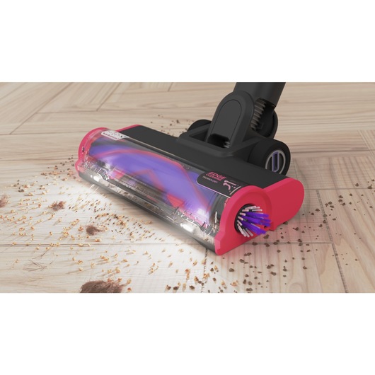 The floorhead in action on a hardwood floor using its LED headlights - BLACK+DECKER SUMMITSERIES select cordless stick vacuum.