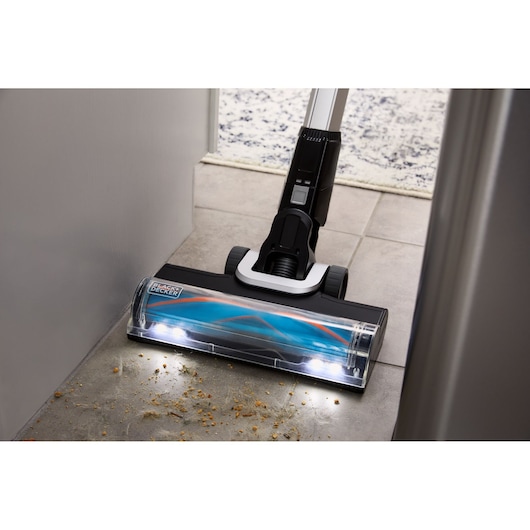 POWERSERIES Extreme MAX vacuuming up dust and debris in a tight space