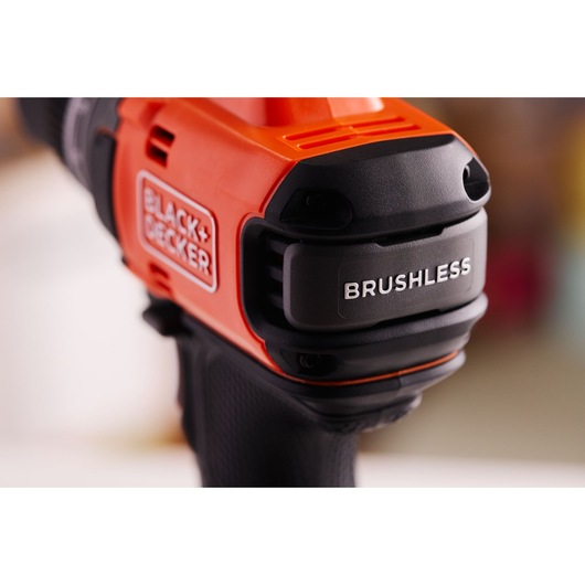 Close-up photo of BLACK+DECKER BLD682XN orange and black brushless power tool handle, branding visible.