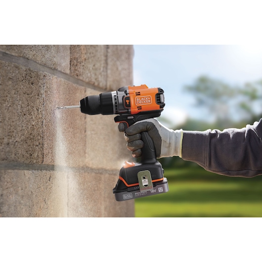 Brickwork being drilled into using the BLACK+DECKER® 18V POWERCONNECT™ Brushless Hammer Drill.